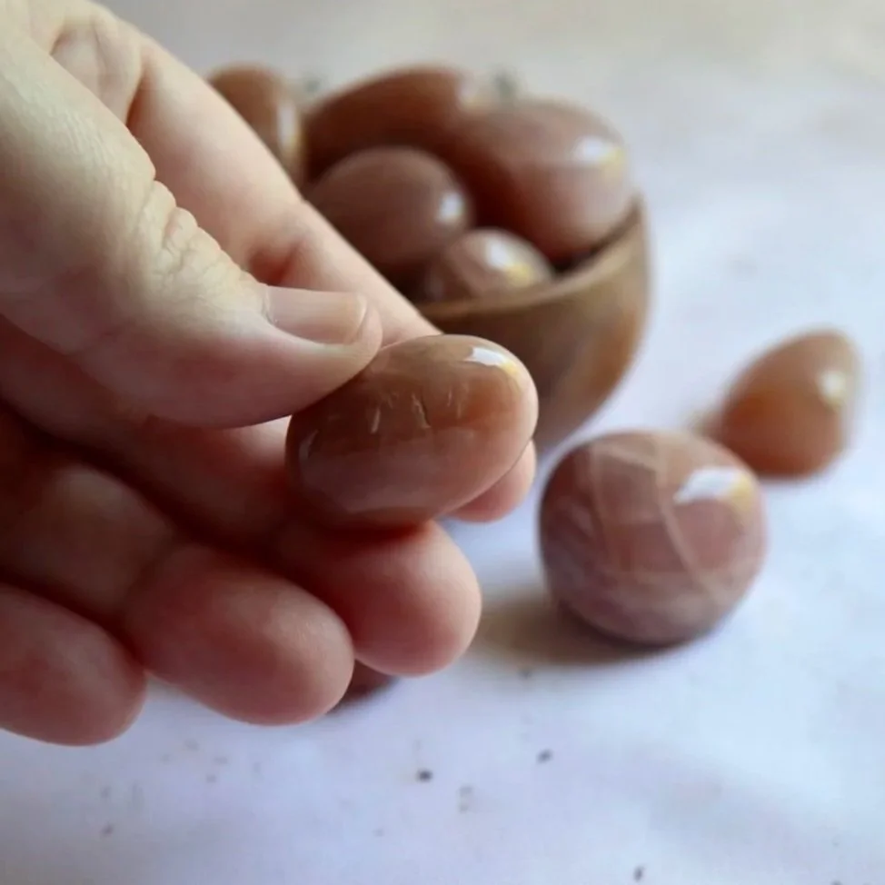 Polished African Sunstone crystal tumble displaying warm peach and orange tones