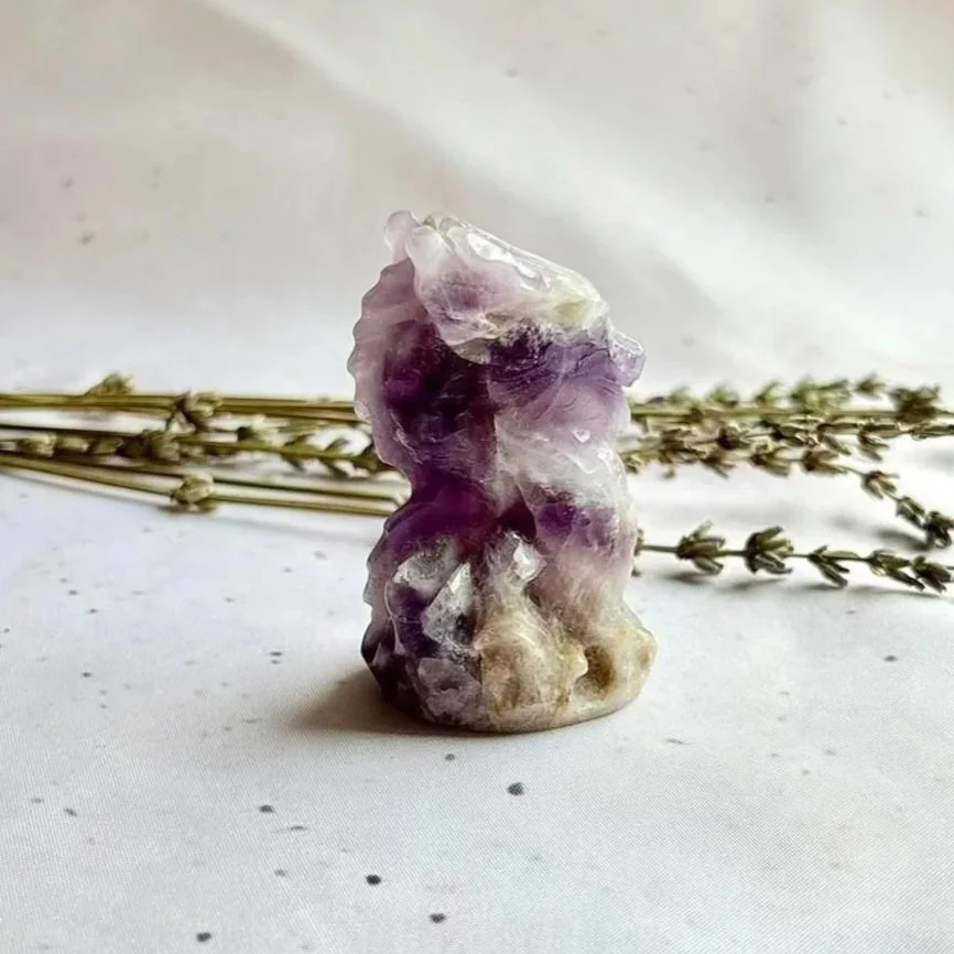 Natural Chevron Amethyst crystal dragon displaying purple and white banding