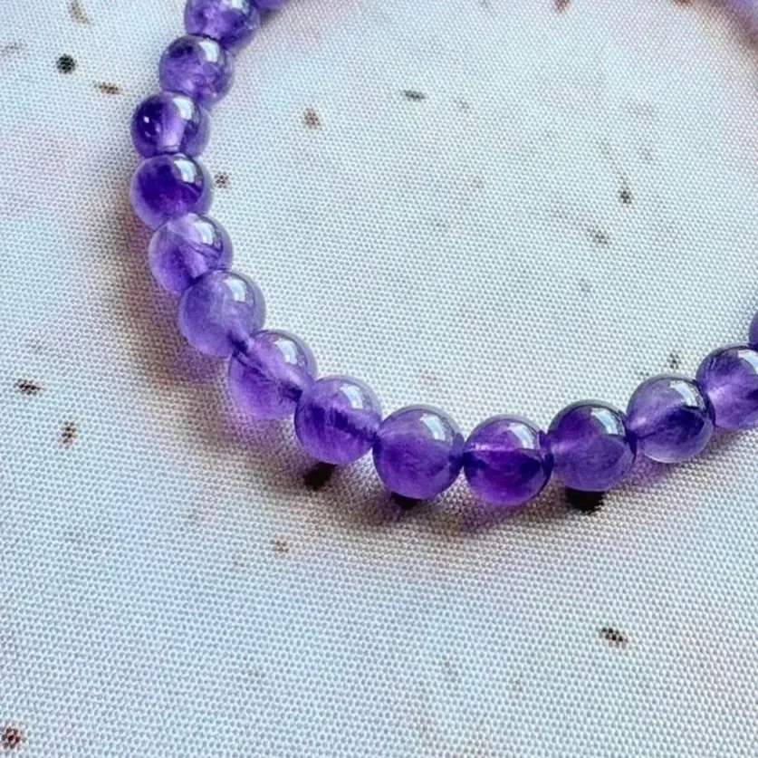 Stretch Amethyst crystal bracelet displaying rich purple gemstone beads