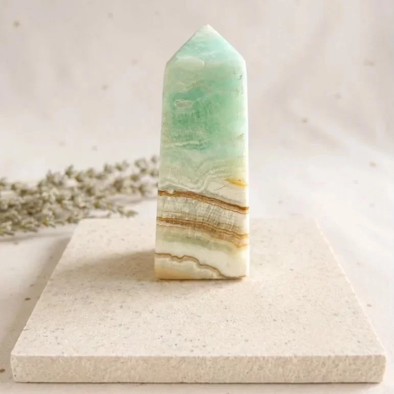 Caribbean Calcite crystal tower, polished natural crystal point measuring approximately 8.5cm tall.