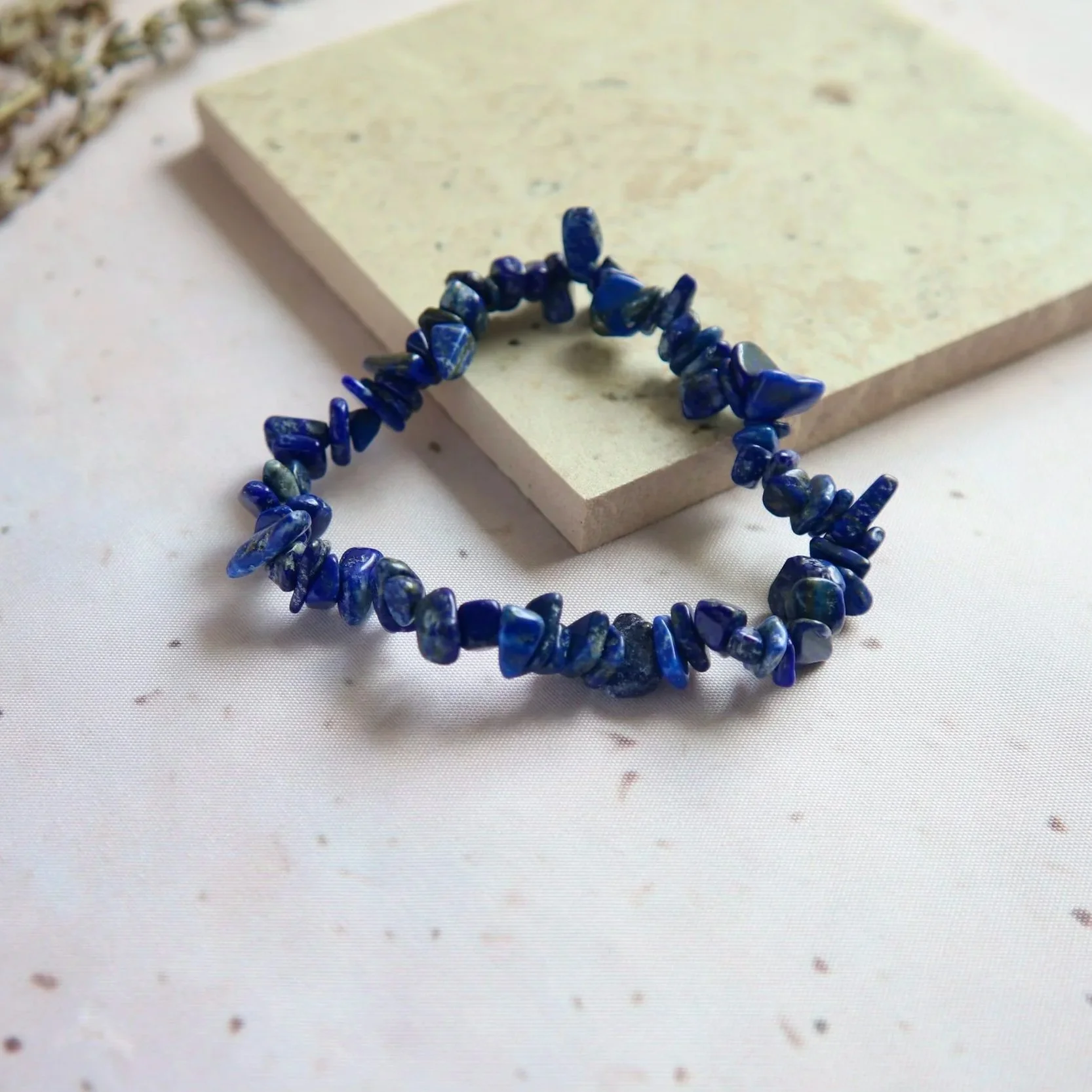 Deep blue Lapis Lazuli chip bead bracelet with natural colour variations.