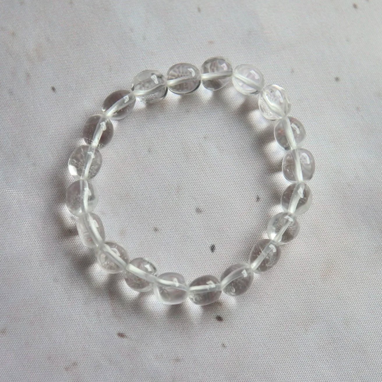 Clear Quartz tumble bead bracelet featuring smooth, polished translucent Quartz beads