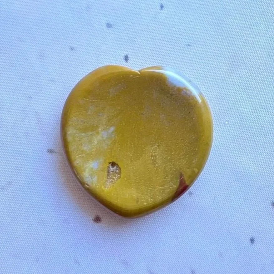 Polished Mookaite heart worry stone measuring approximately 4cm