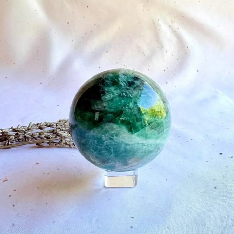 Rainbow Fluorite crystal sphere displaying green and purple natural banding