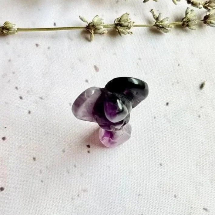 Amethyst angel associated with peace, intuition, and emotional balance