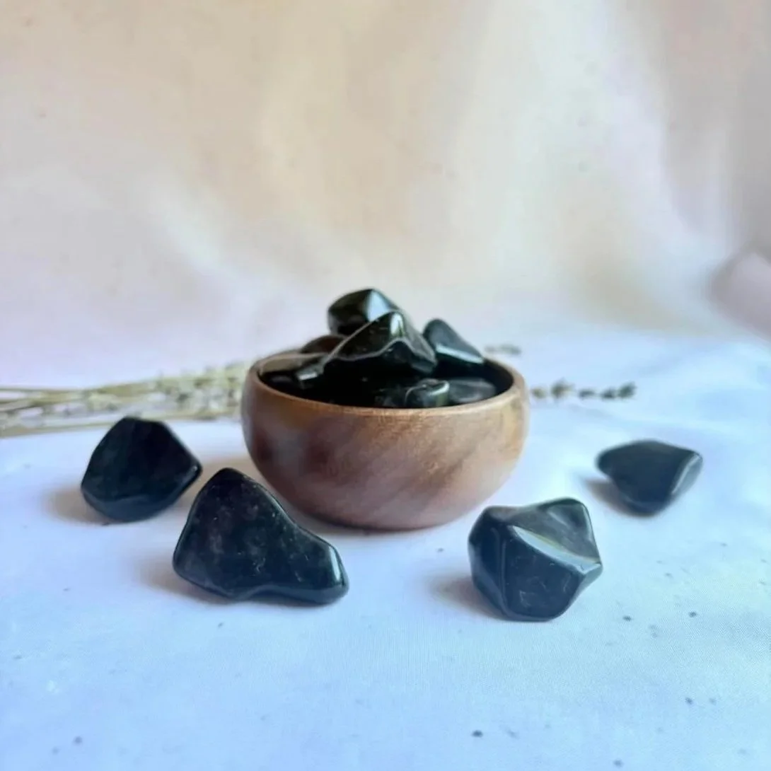 Black Obsidian tumble associated with protection, grounding, and emotional clarity