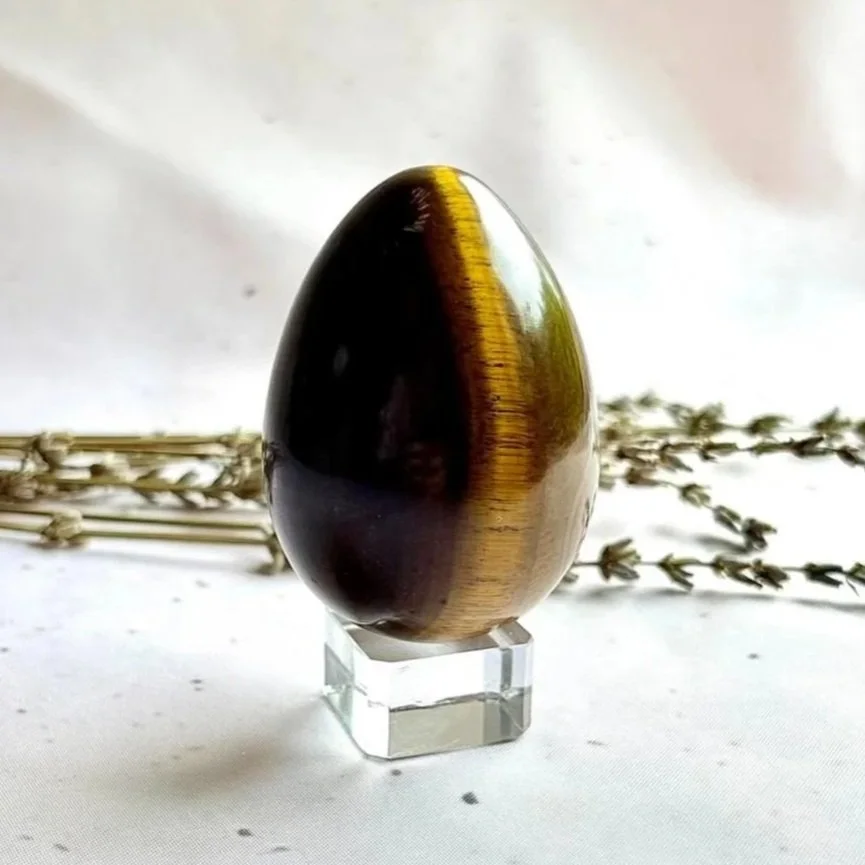 Polished Tiger's Eye crystal egg with chatoyant shimmer