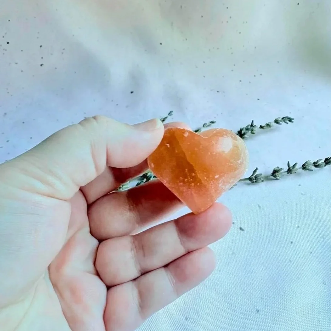 Polished Peach Satin Spar crystal heart displaying a silky natural sheen