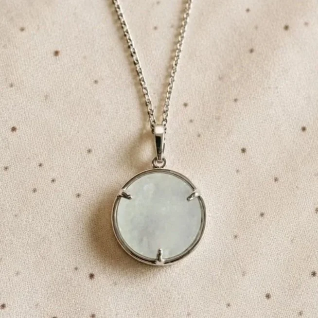 Clear Quartz crystal point necklace with celestial moon and star frame