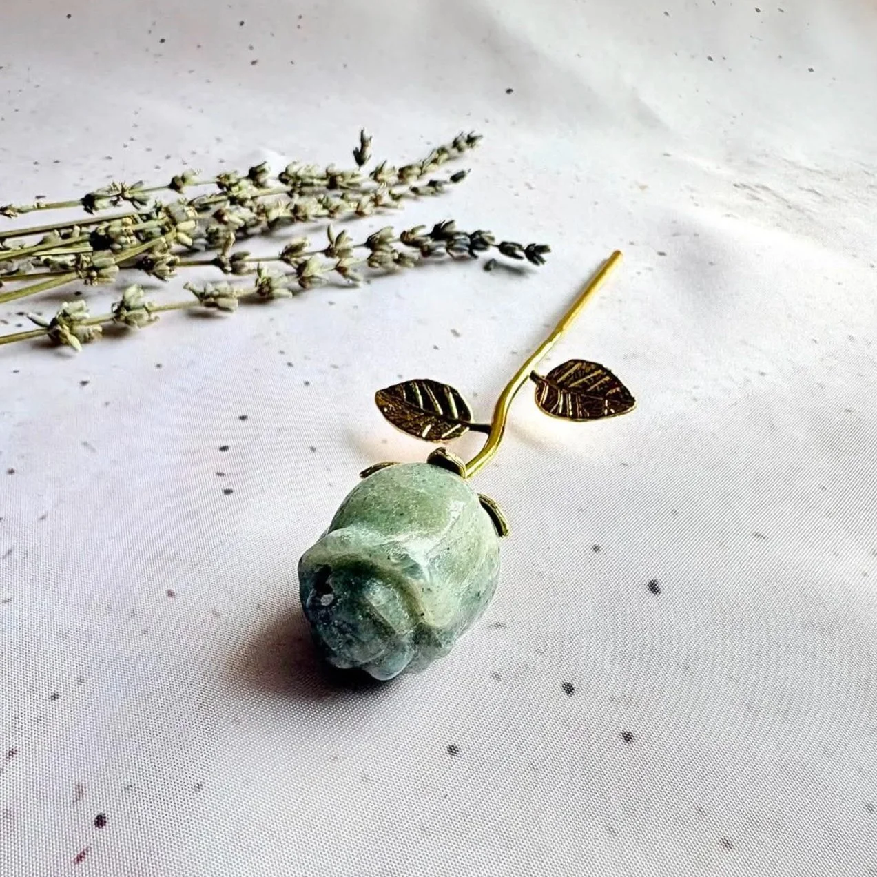 Labradorite crystal rose with a gold stem and leaf detail