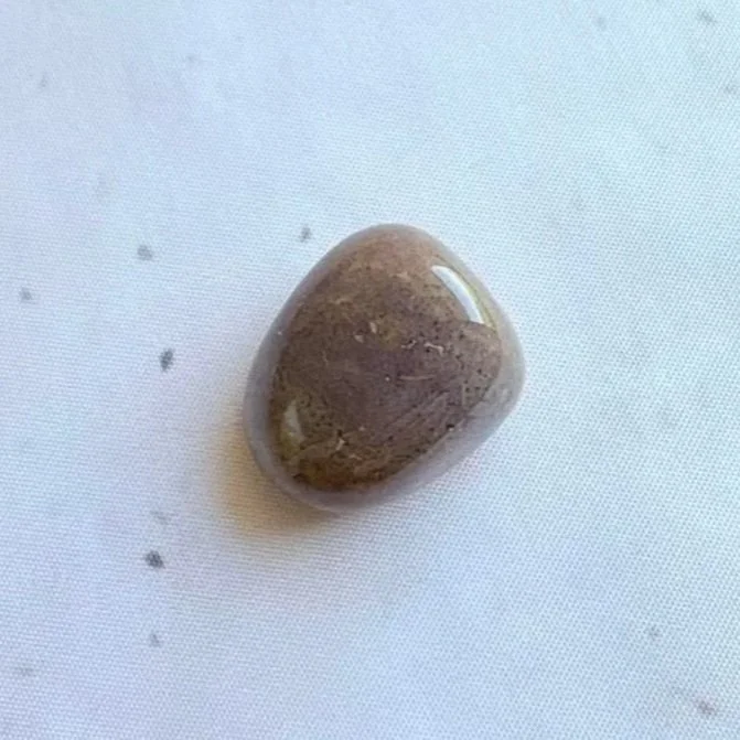 Bloodstone tumble weighing approximately 14 grams with natural red inclusions
