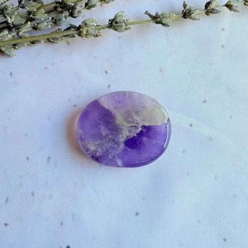 Natural Amethyst oval worry stone with polished finish and thumb indentation