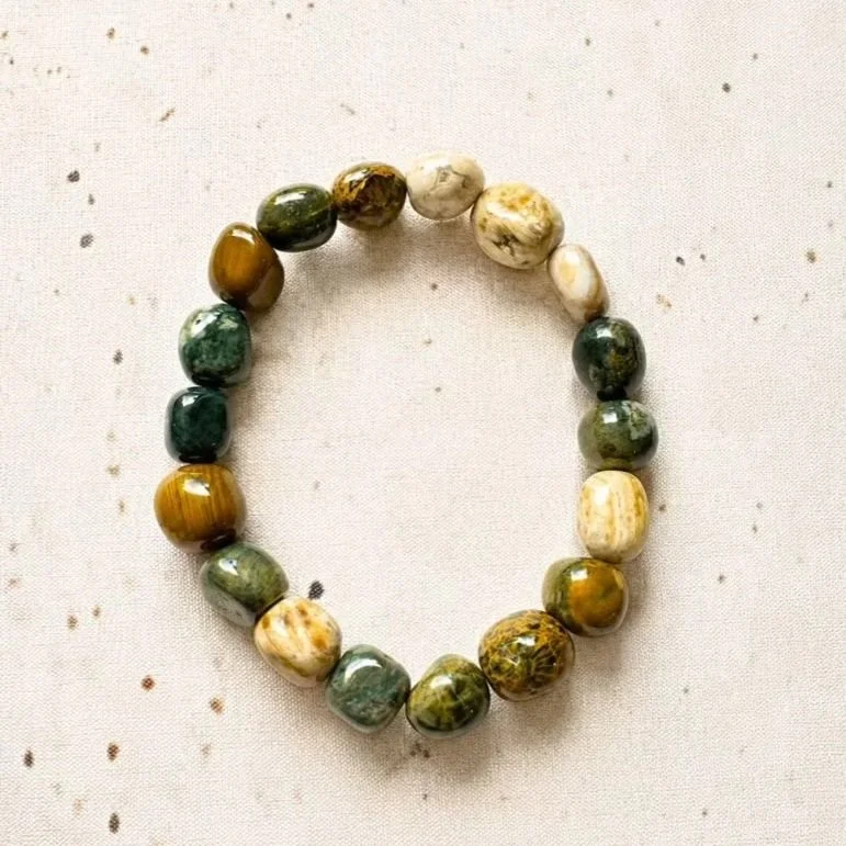 Rainforest Jasper crystal bracelet with polished 8-12mm tumble beads displaying natural earthy patterns and colours.