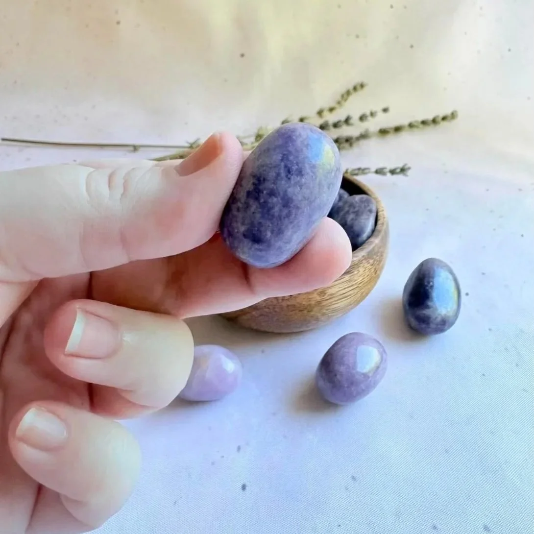 Natural Lepidolite crystal tumble displaying soft lilac tones and shimmer