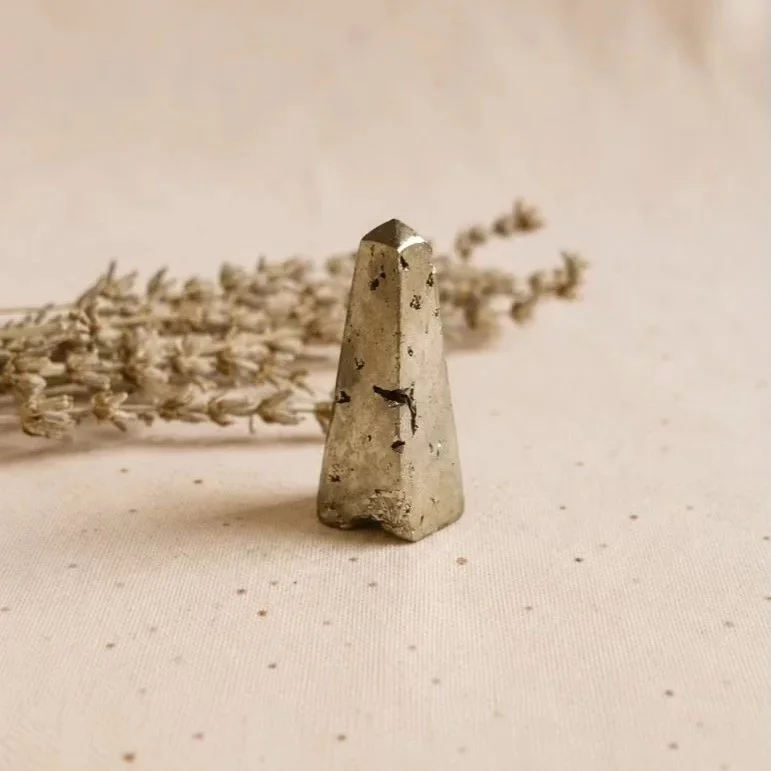 Polished Pyrite crystal tower displaying natural metallic shimmer and geometric tower shape for collection and display purposes