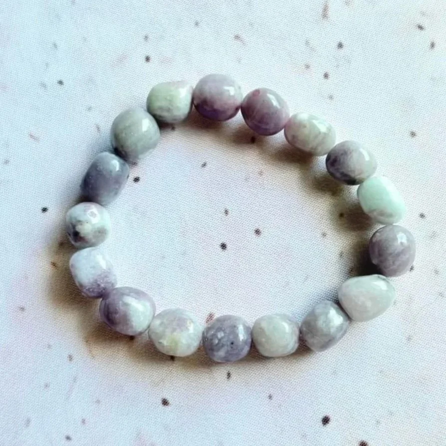 Natural Quartz with Pink Tourmaline bead bracelet featuring beads between 8mm and 12mm