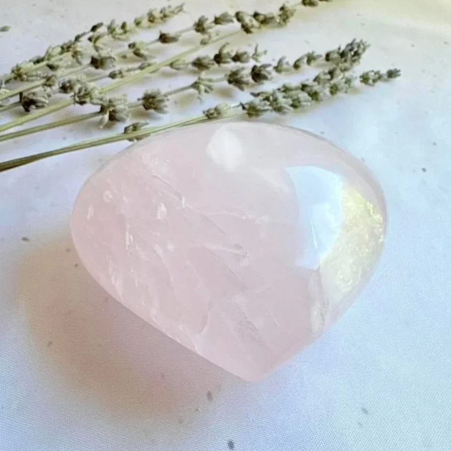 Natural polished Rose Quartz crystal heart with soft pink colouring