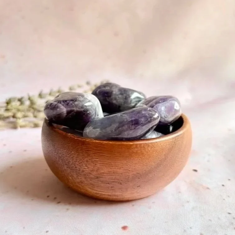 Natural Chevron Amethyst tumble displaying purple and white banding with a polished finish