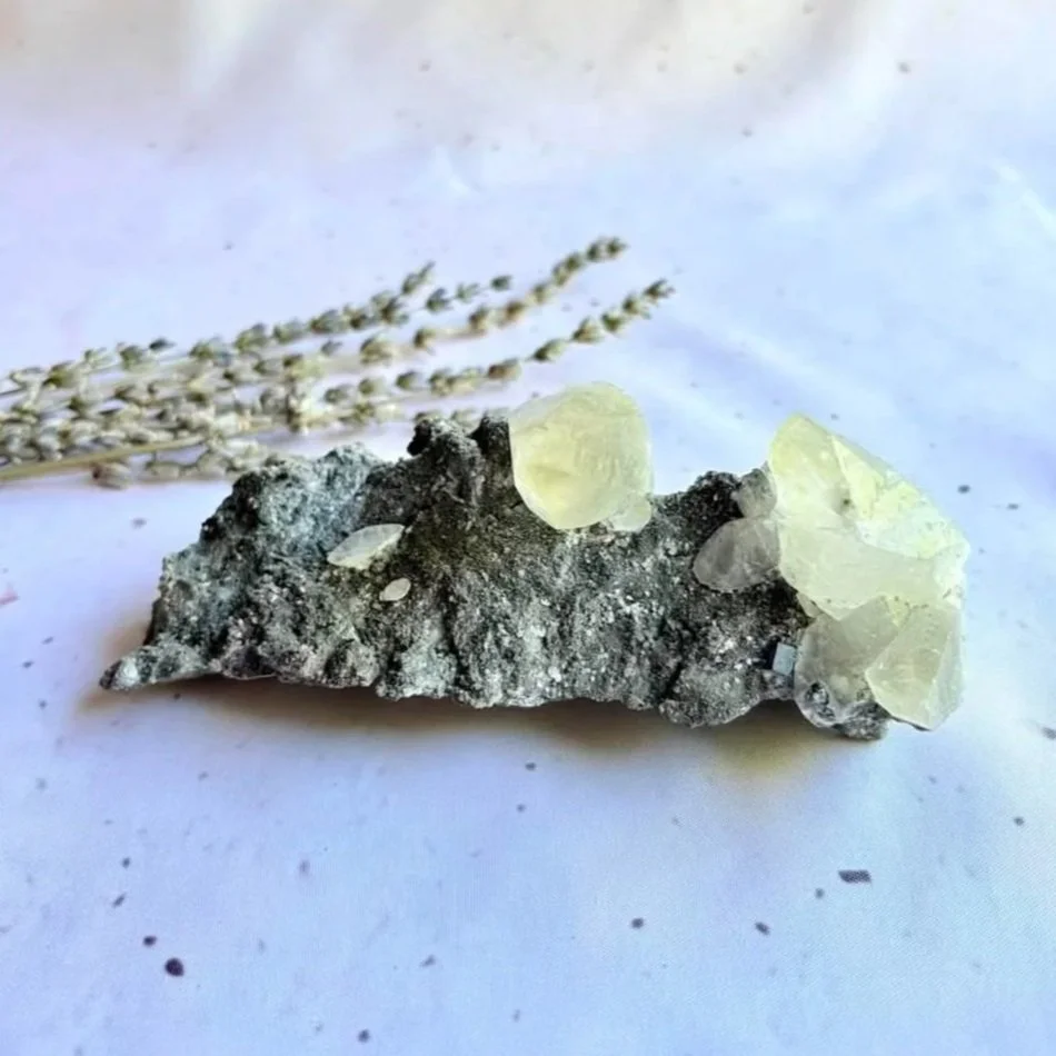 Dogtooth Calcite crystal cluster displaying distinctive pointed crystal formations on natural matrix