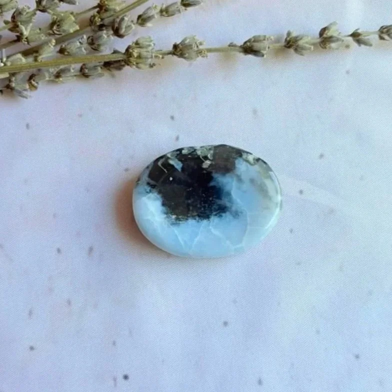 Natural Orca Agate oval worry stone with polished finish and thumb indentation