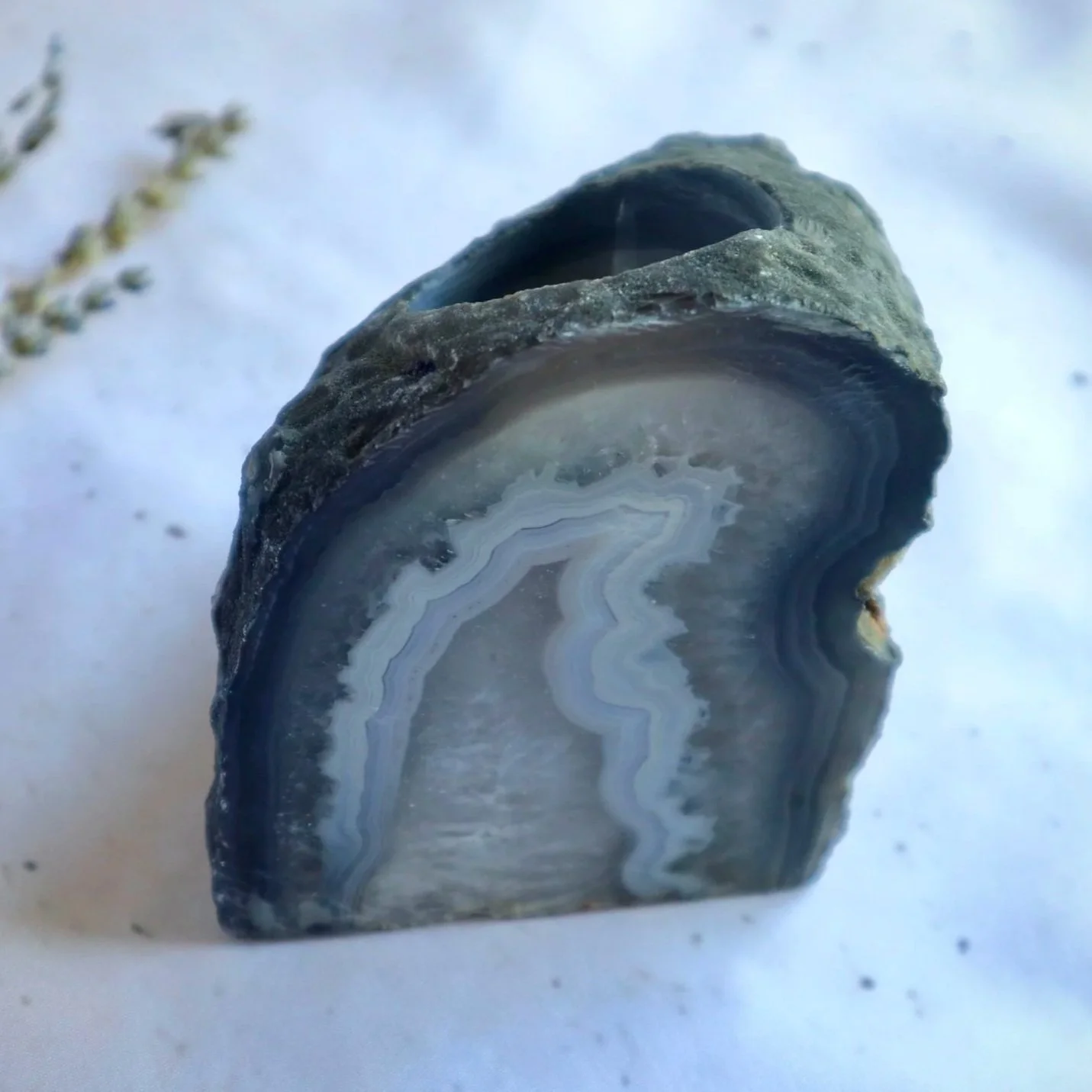 Natural grey and blue agate tealight candle holder from Brazil featuring unique crystal patterns.