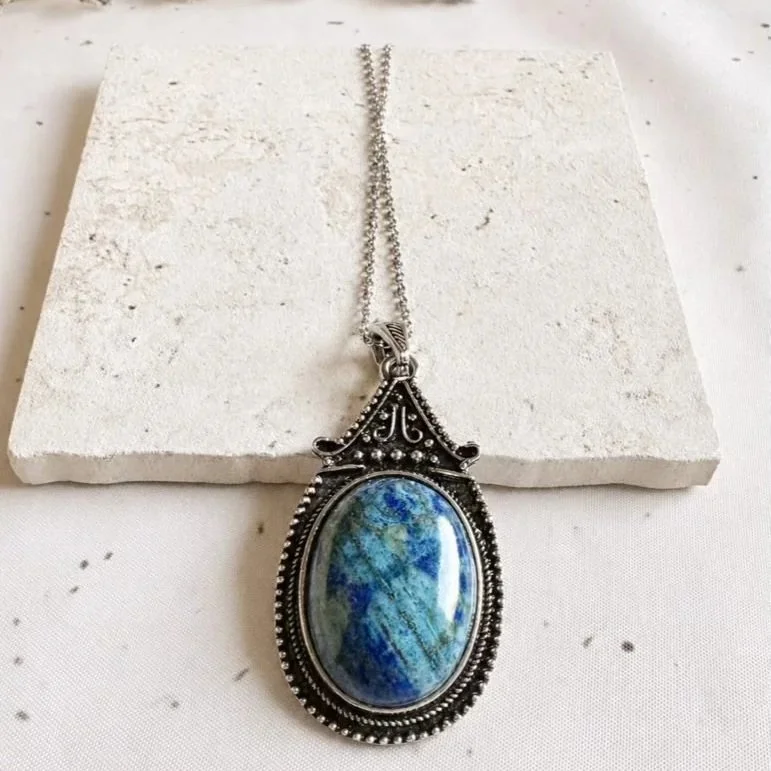 Lapis Lazuli pendant necklace with antique silver-toned mount and deep blue gemstone