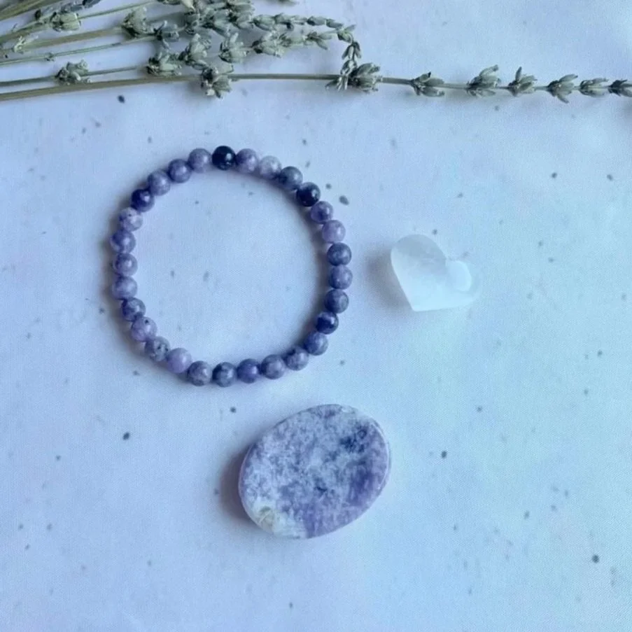 Crystal self-care gift set presented in a brown pillow box with twine