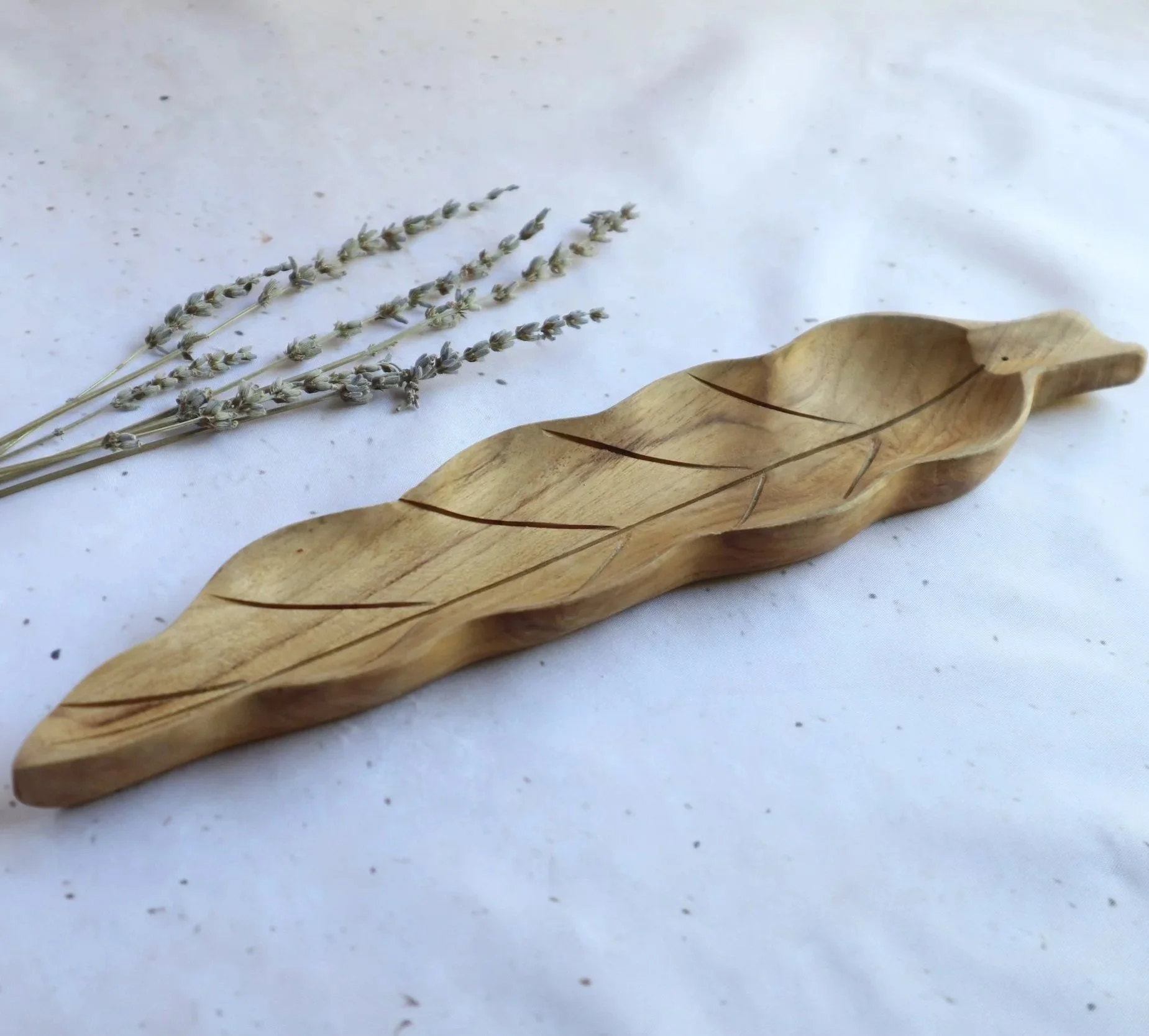 Natural wooden leaf incense plate with carved leaf vein details for burning incense sticks.