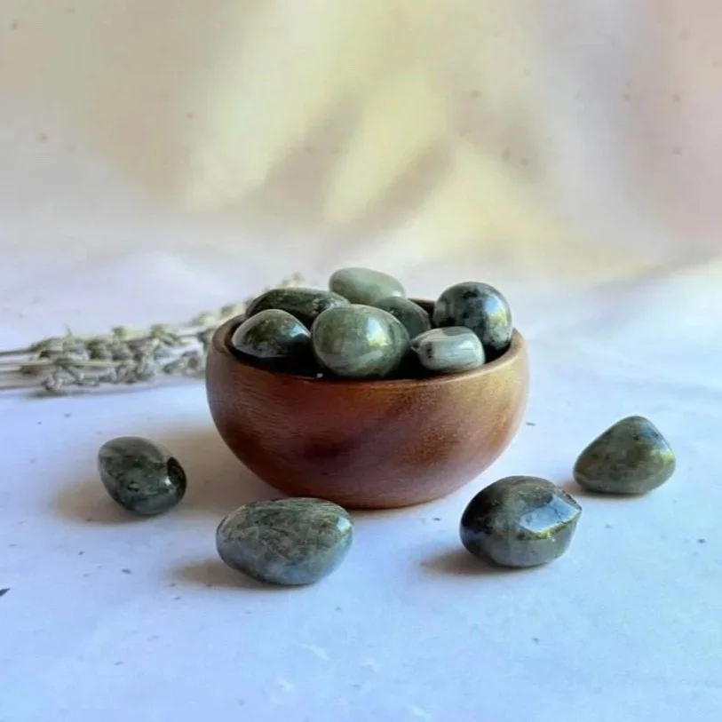 Labradorite tumble associated with intuition, protection, and personal transformation