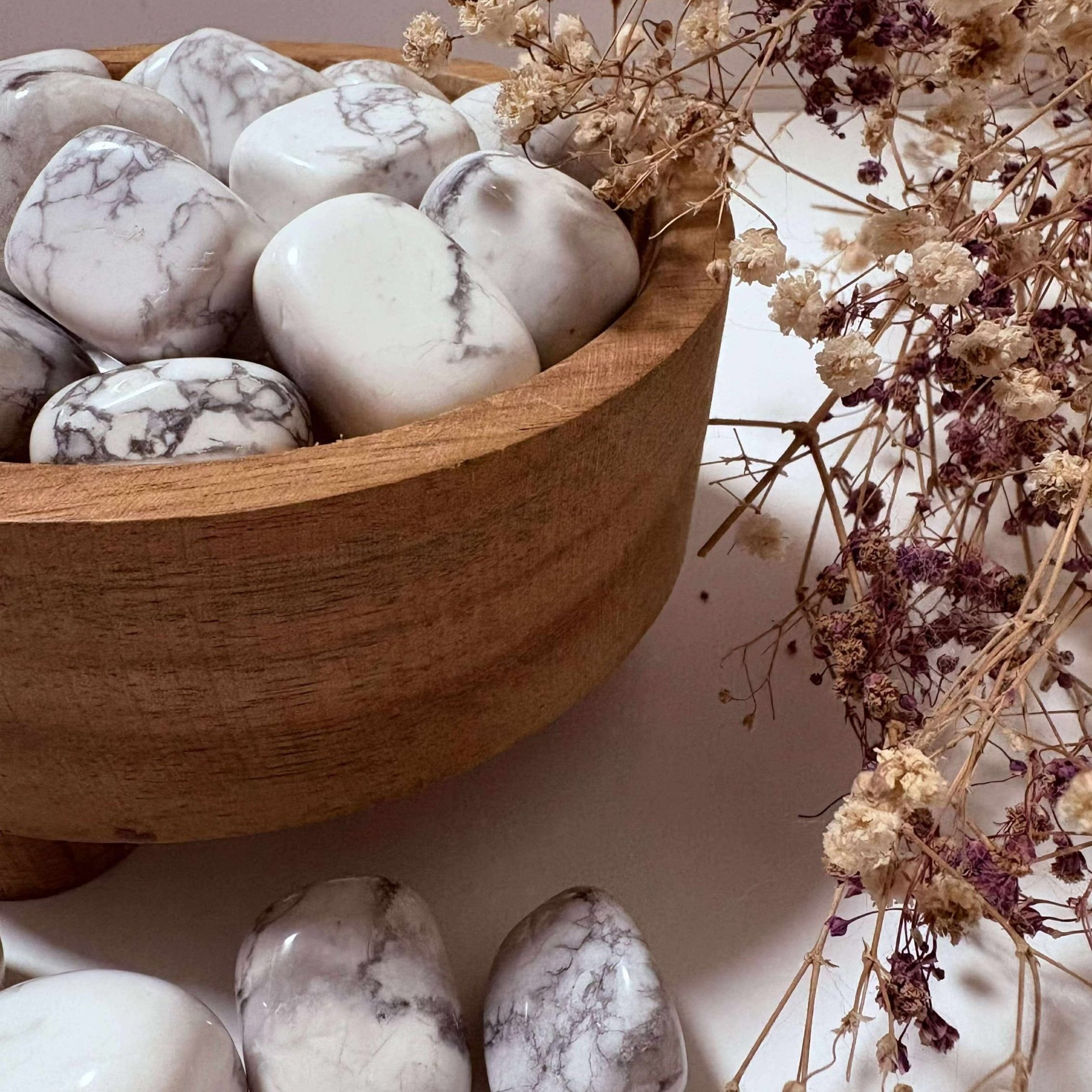 Howlite tumble stone from Sunflower Hollows, smooth white crystal with grey veining, known for calming energy and stress relief