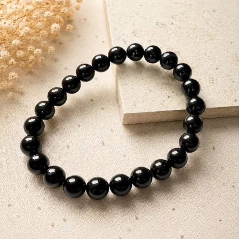 Natural Black Obsidian stretch bracelet featuring polished approximately 6mm round black gemstone beads.