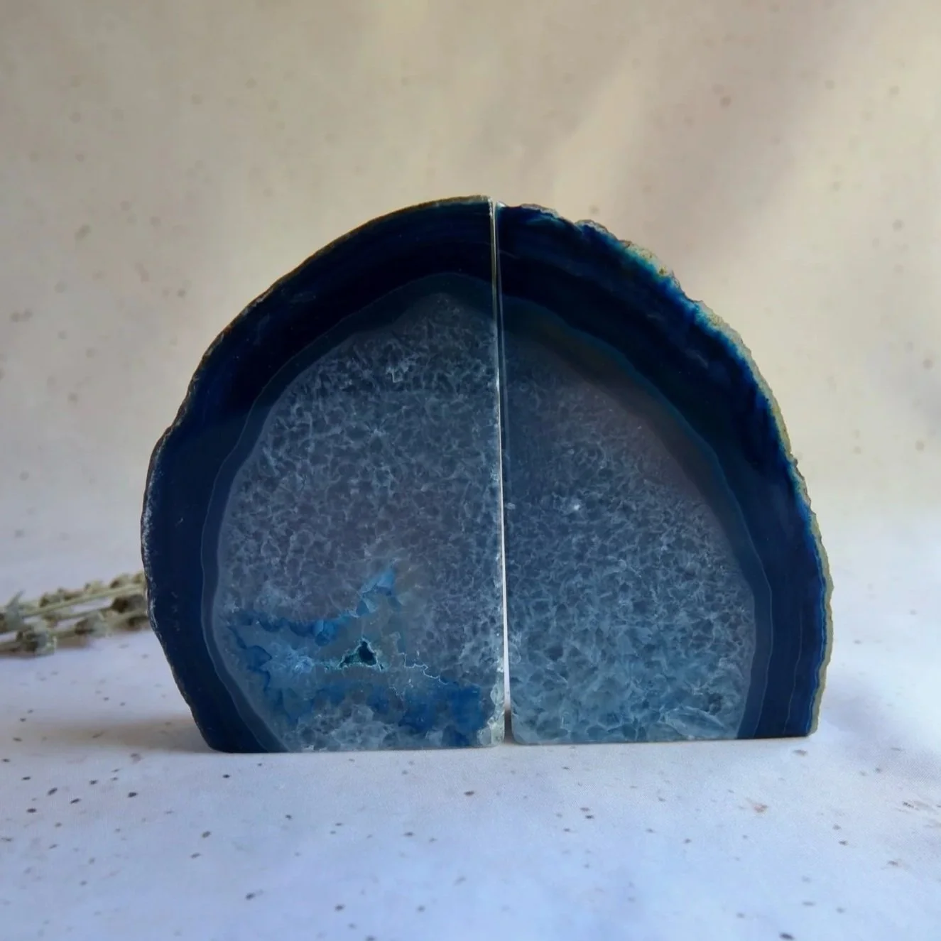 Dyed blue Agate bookend pair with natural banding and polished finish