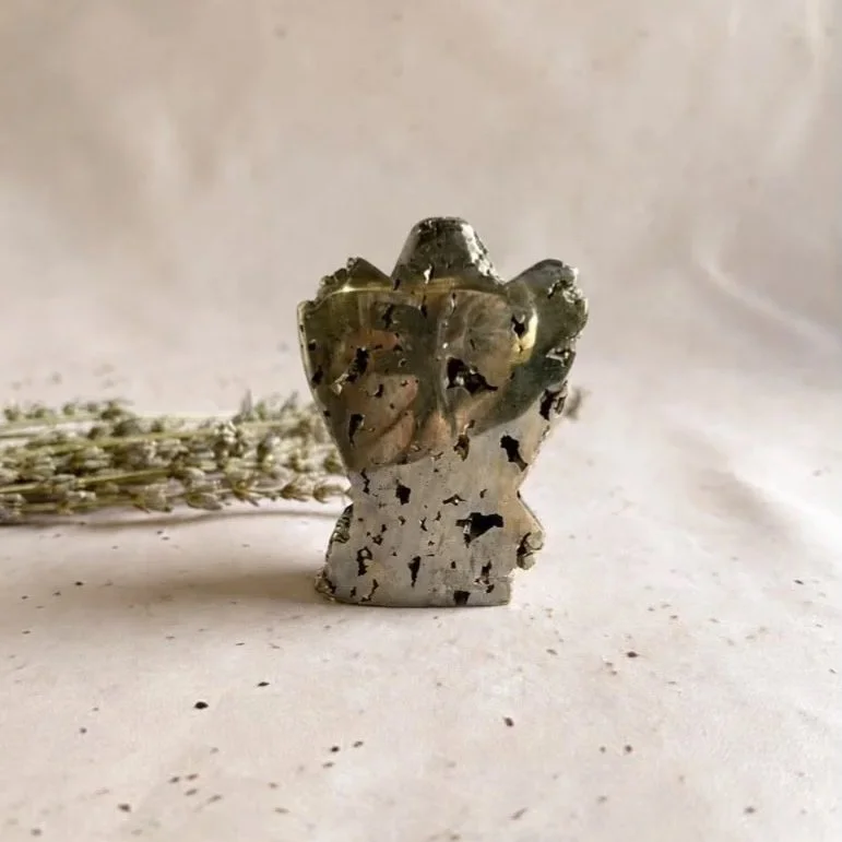 Pyrite crystal angel display piece showing natural golden shimmer