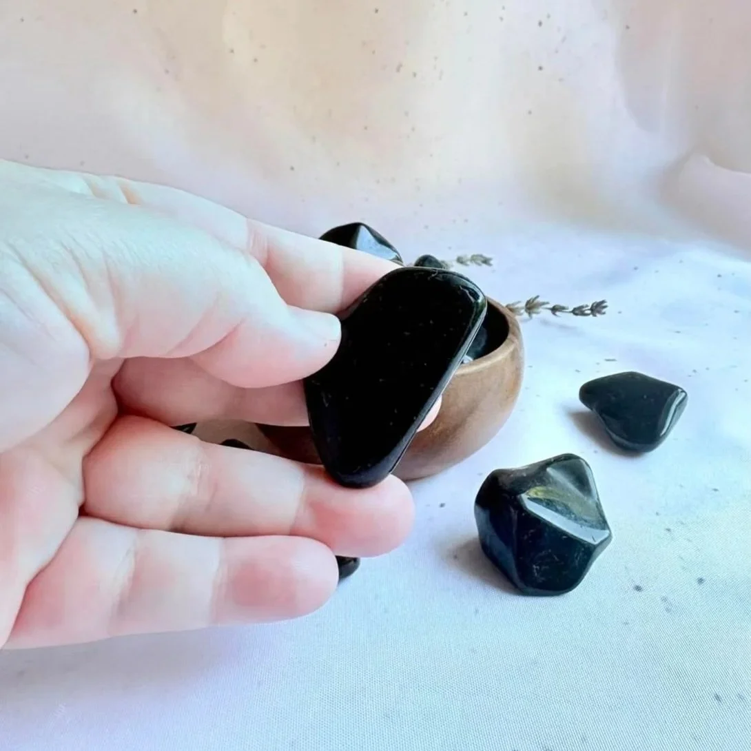 Polished Black Obsidian crystal tumble with a glossy black surface