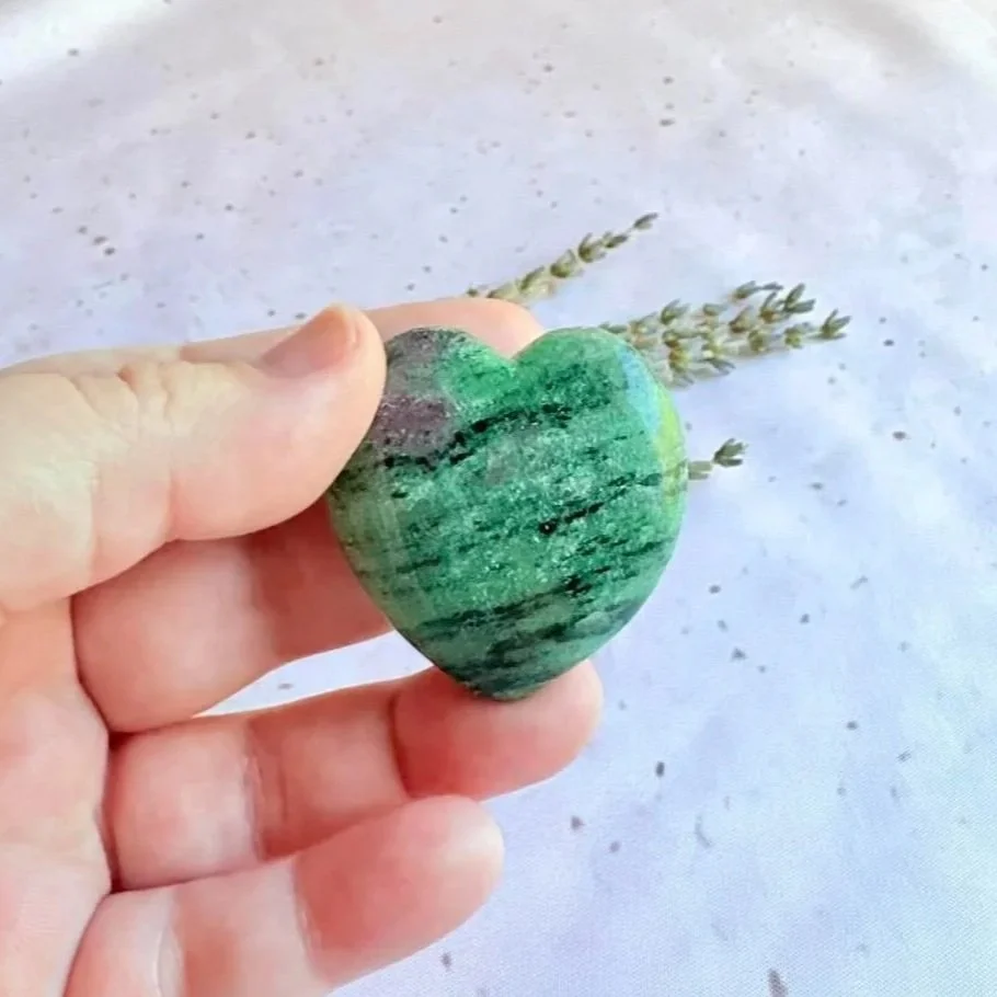 Natural polished Ruby Zoisite crystal heart featuring green banding and ruby inclusions