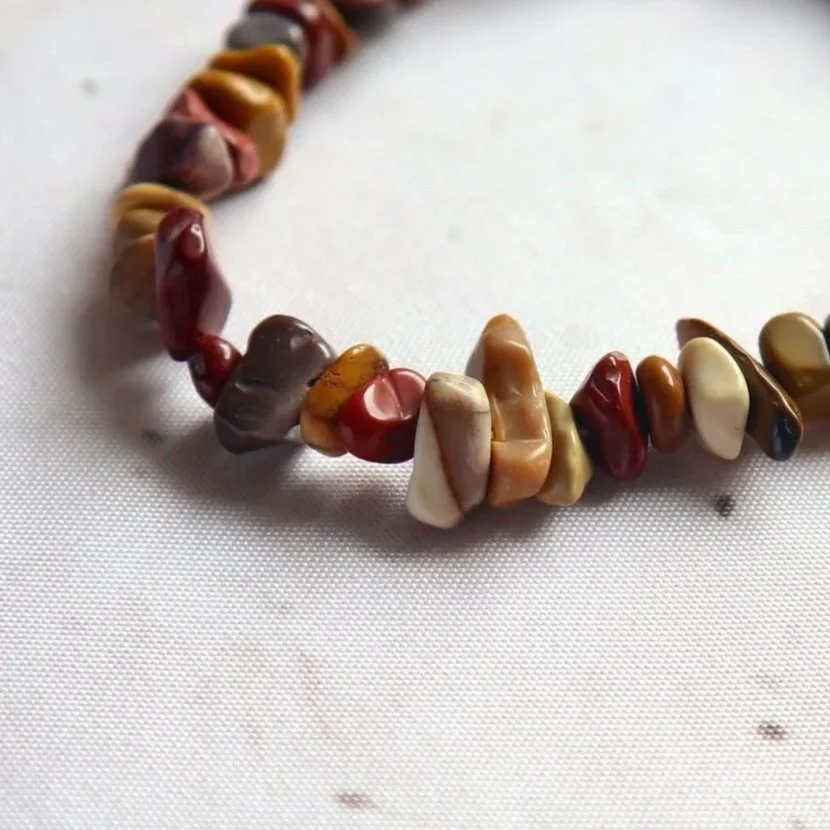 Natural Mookaite crystal chip bracelet with irregular polished stone pieces and varied colours