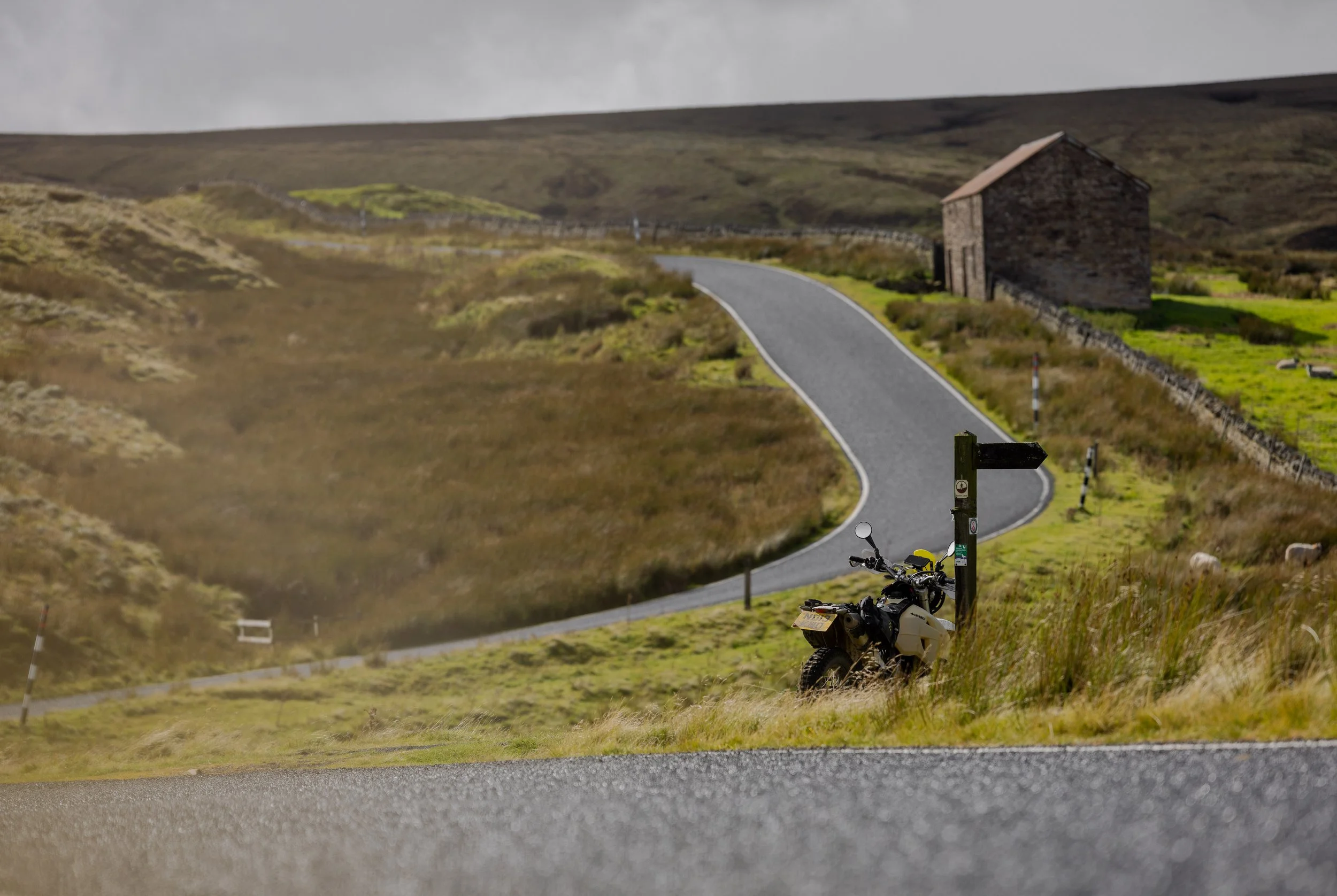 The 450 leans up on one of the deserted roads near Allenbanks, Northumberland, England. 2025.