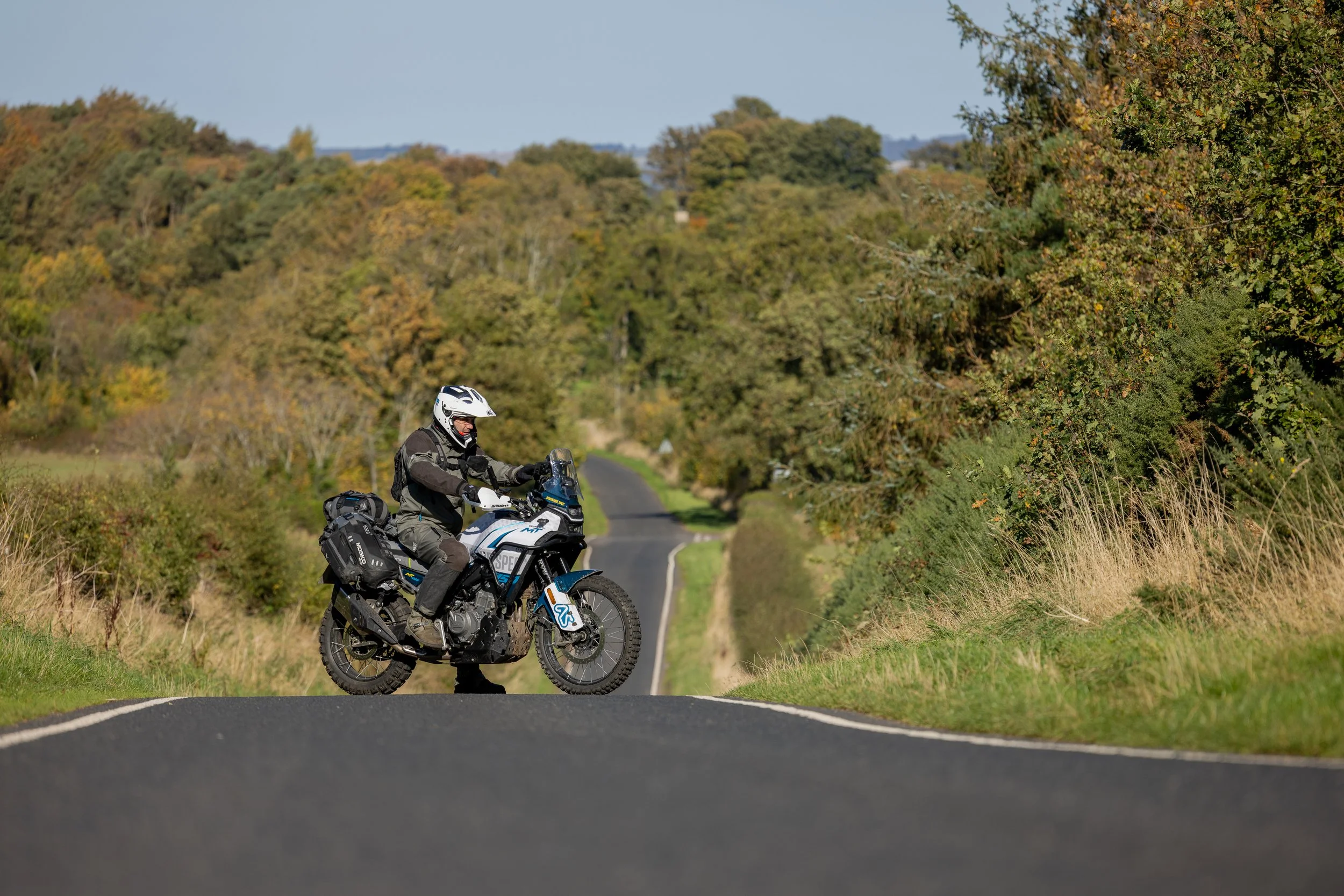 Jim adopts 'fiddle with the GPS' pose on a deserted Scottish B road. 2025. 
