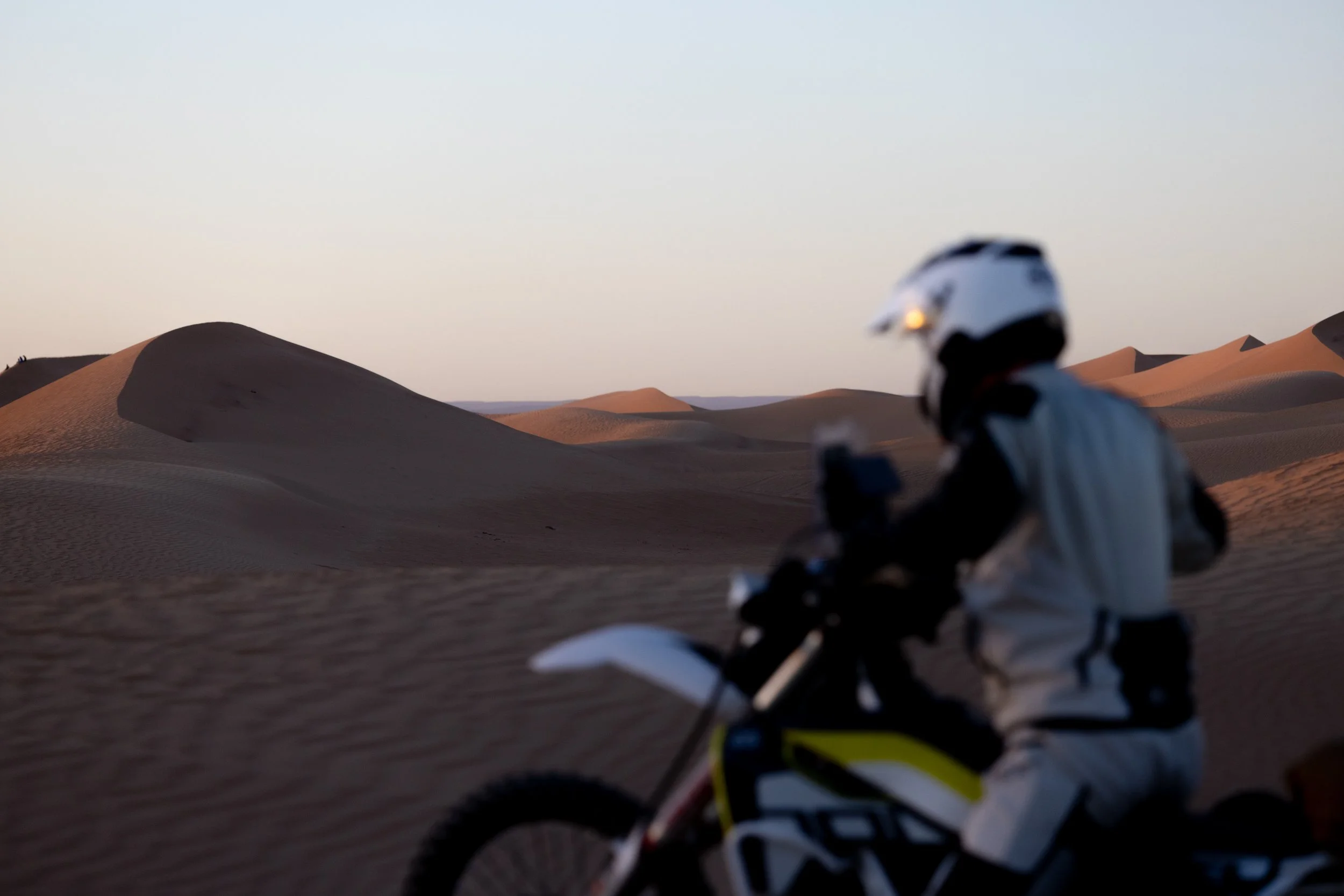 Jim rides his Husqvarna 701 into the first dunes of the trip. Having never ridden on sand before, and on a heavier bike riding into the setting sun, Jim's skills were pushed to the limit. The saying goes, its easier to ride fast on sand. But then aga
