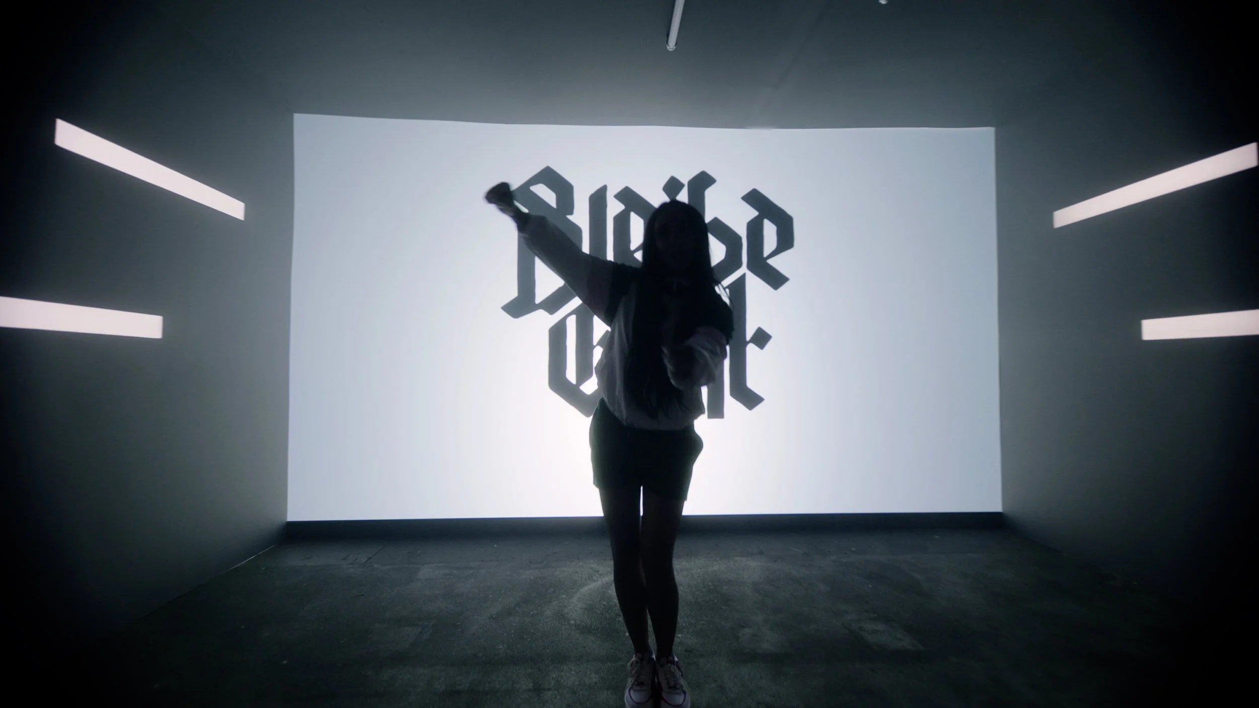 liz standing in front of canvas, silhouette