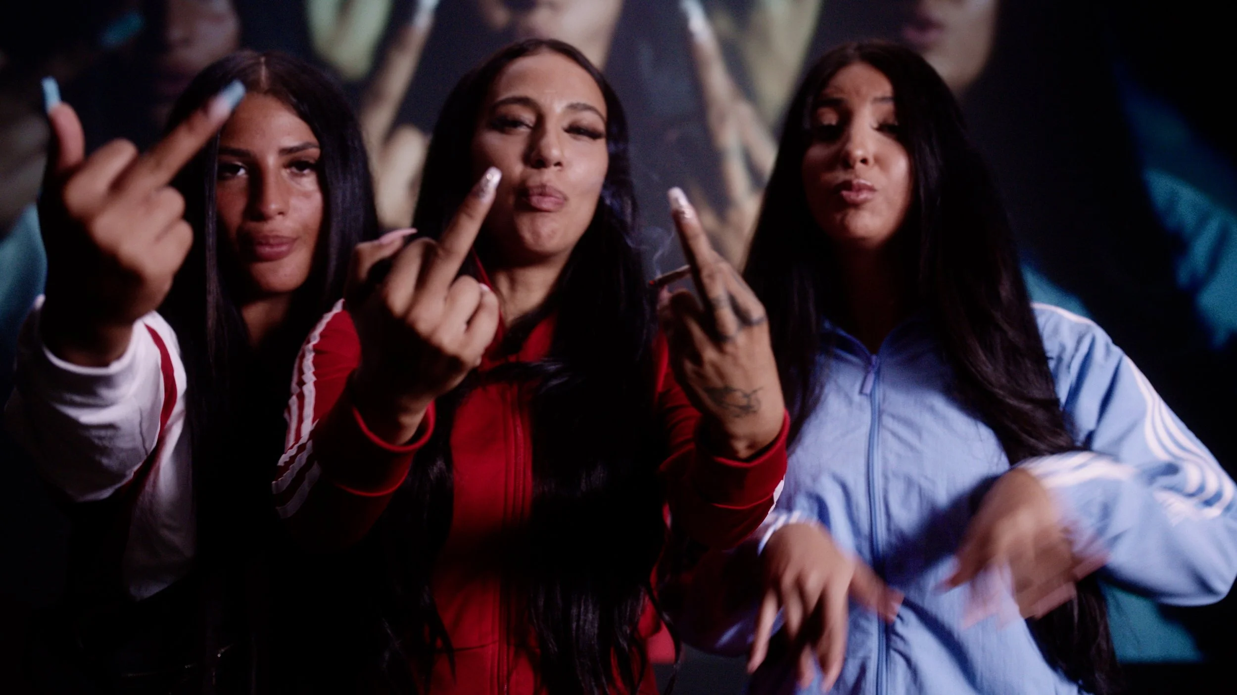 liz and two women posing with middle fingers up
