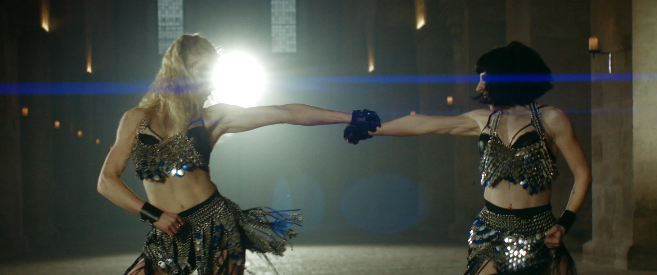 two girls dancing in armour