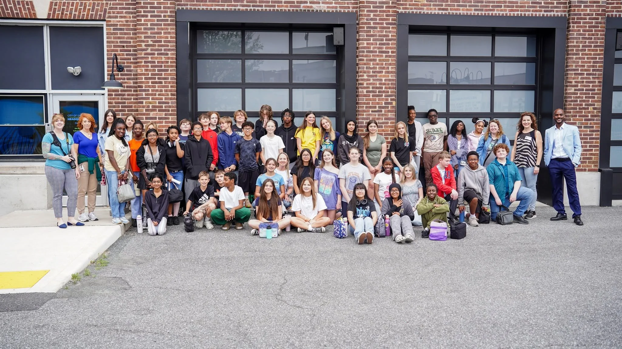 wbms-students-group-photo-outside-brick-building.jpg