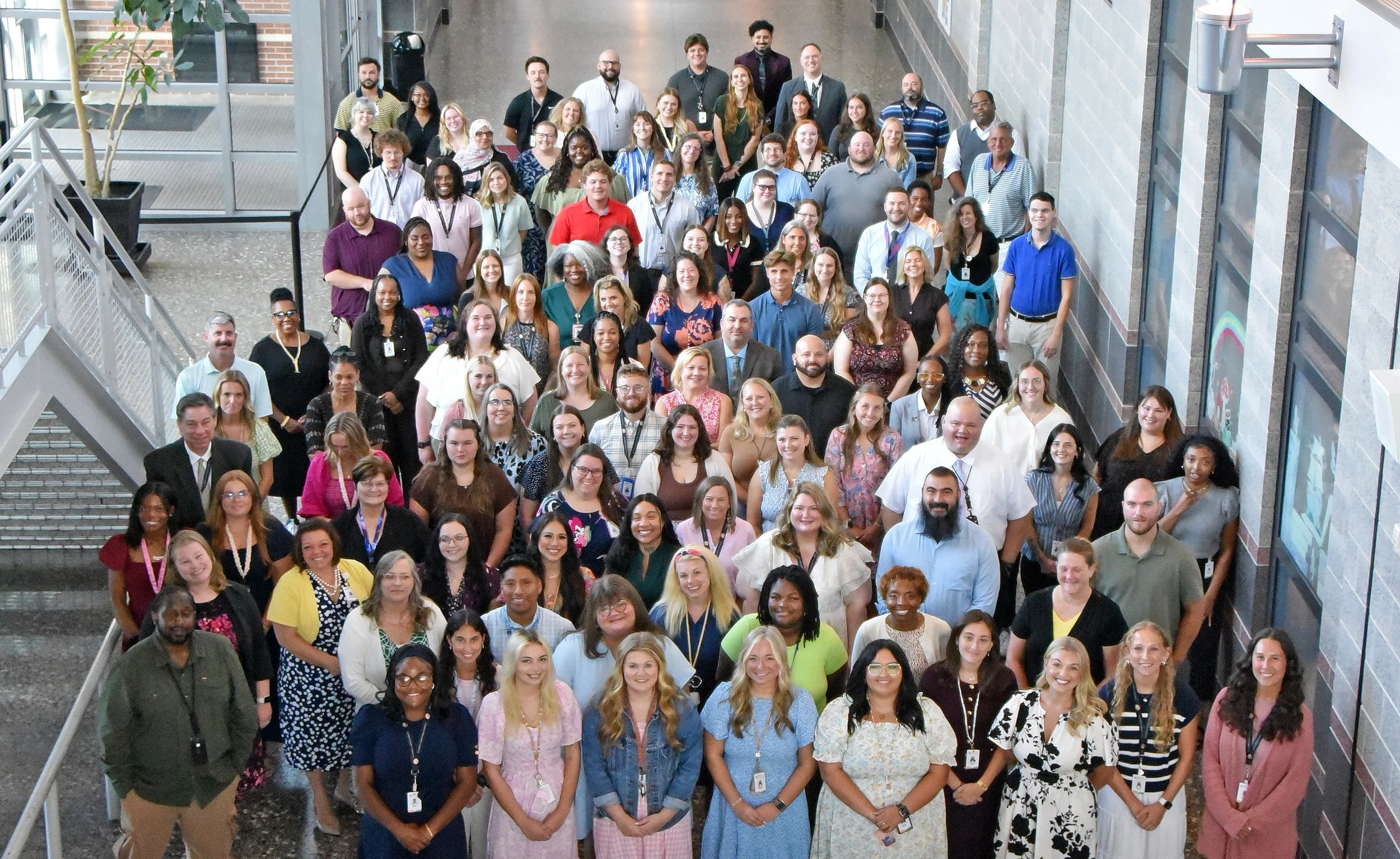 wcps-staff-group-photo-on-stairs.jpg