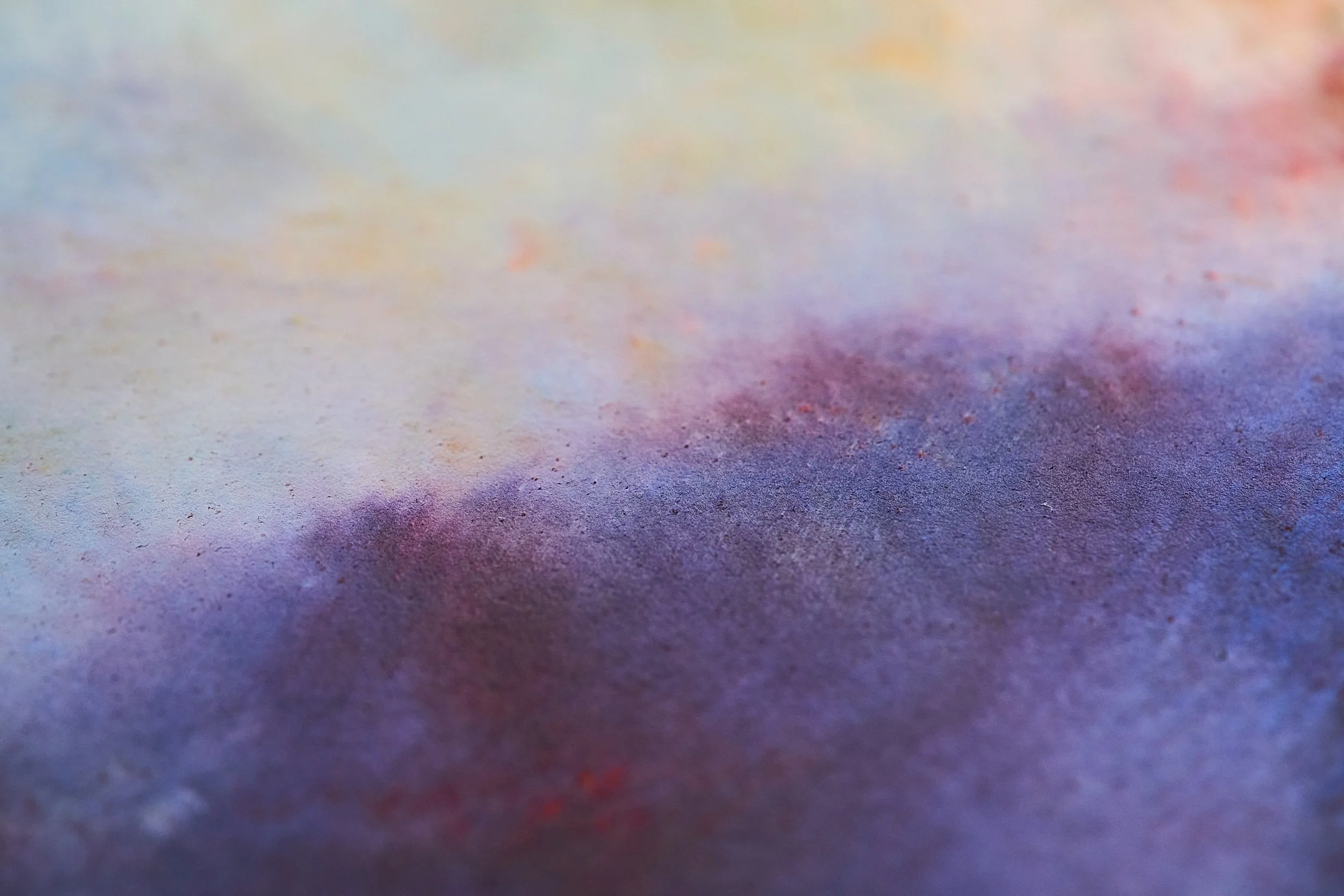 Abstract background with soft pastel shades blending into each other.