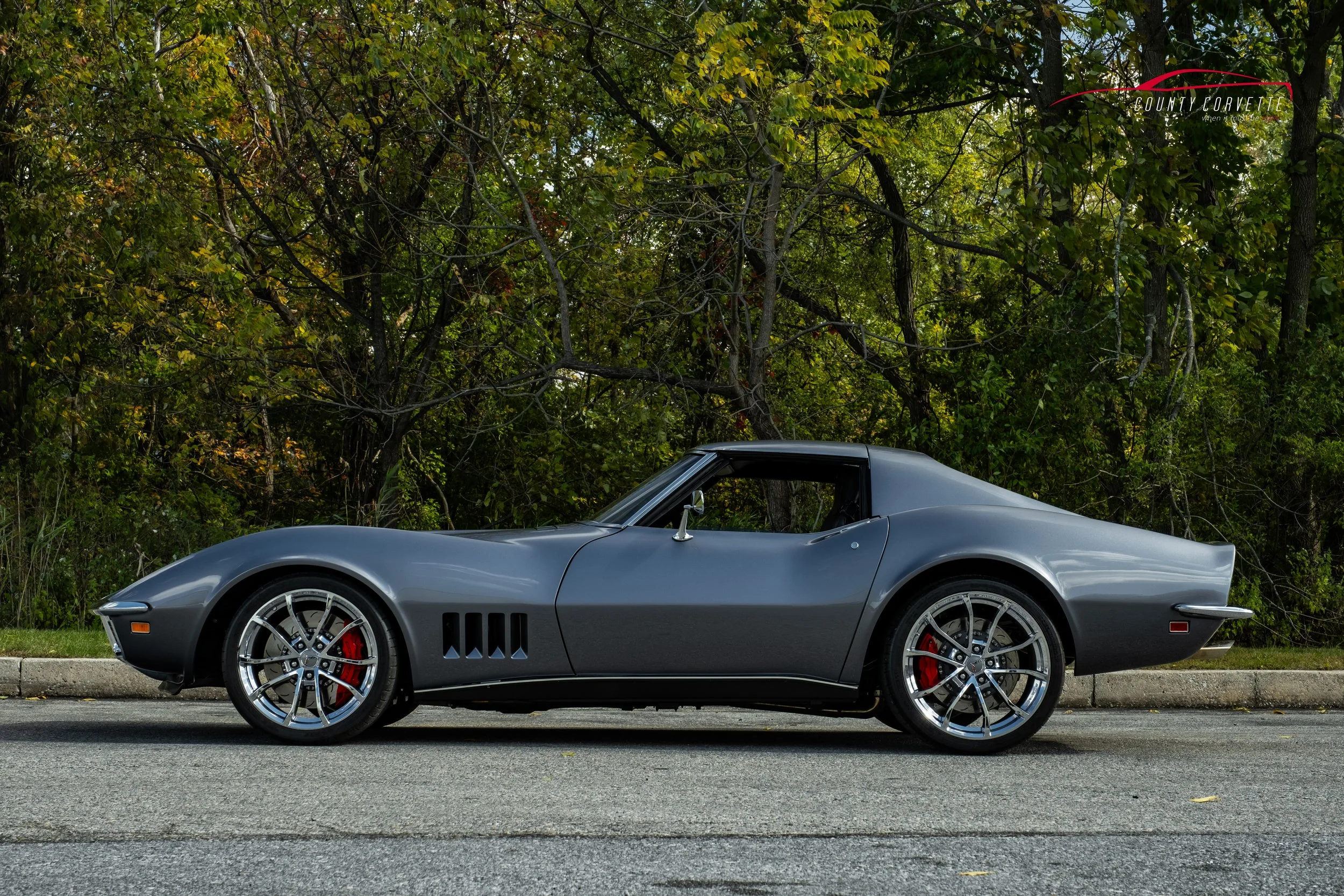 Hand built in Pennsylvania by County Corvette. This 1969 Corvette Restomod with 6.2L LS3 V8, Tremec 6-Speed Manual Transmission, and much more. This Chevrolet Corvette wears a custom silver metallic paint, with a black leather interior. Amenities inc