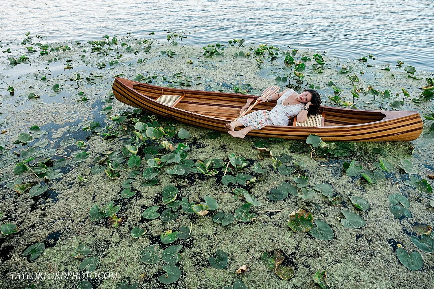 high school senior girl on a canoe on webster lake in north webster indiana