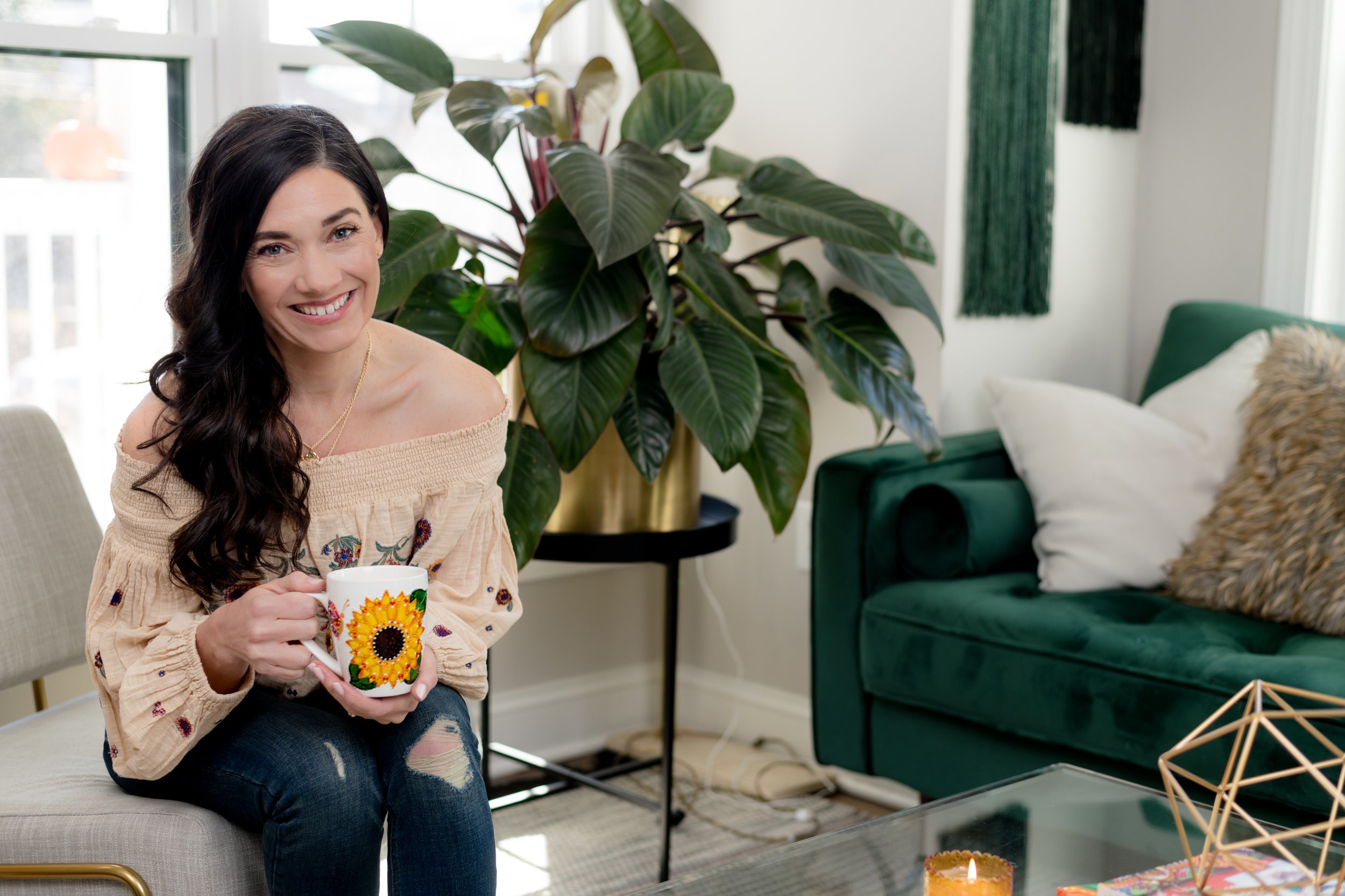 Engaging woman on a serene green sofa, the contrast of her blouse and the book's spine creating a visual harmony, her pose suggesting a moment stolen with her latest read.