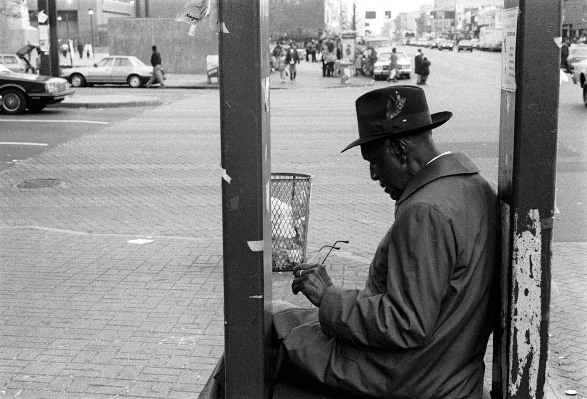 Man_Seating_at_Bus_Stop_01-1.jpeg