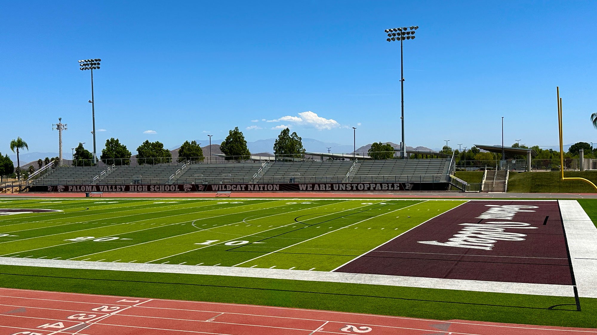 High school field and wind screen graphics, branded for Paloma Valley High School